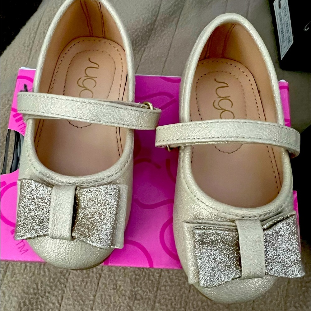 Gold little girls shoe from Macys gently used in original box
